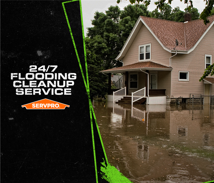 Home surrounded by flood water and  24/7 Flooding Cleanup Service and SERVPRO logo caption