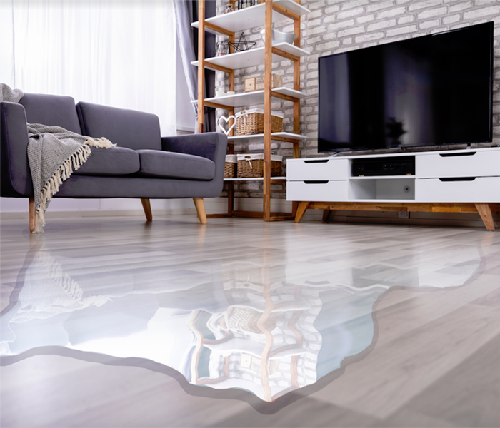 water covering the floor of a living room